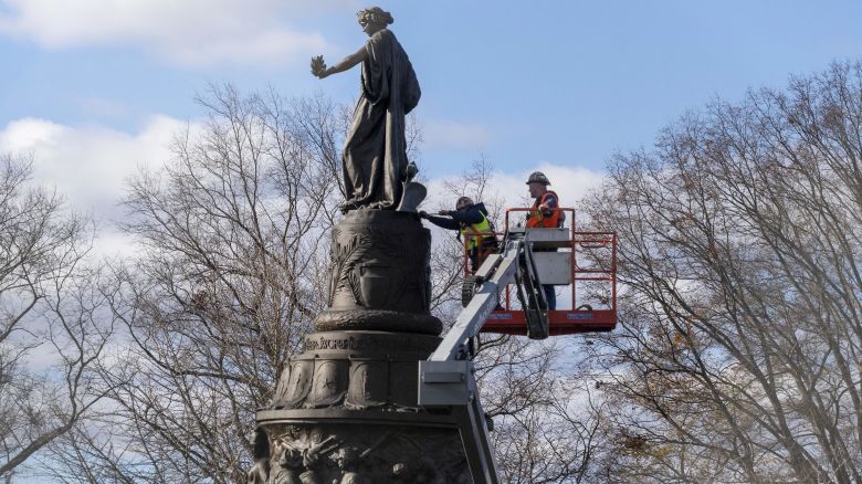 Workers prepare a Confederate Memorial for removal in Arlington National Cemetery on Monday, Dec. 18, 2023 in Arlington, Va. The Confederate memorial is to be removed from Arlington National Cemetery in northern Virginia in the coming days, part of the push to remove symbols that commemorate the Confederacy from military-related facilities. (AP Photo/Kevin Wolf)